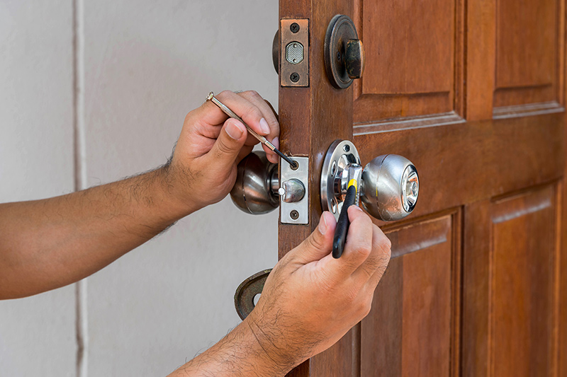 New lock being installed on a residential door in Delaware