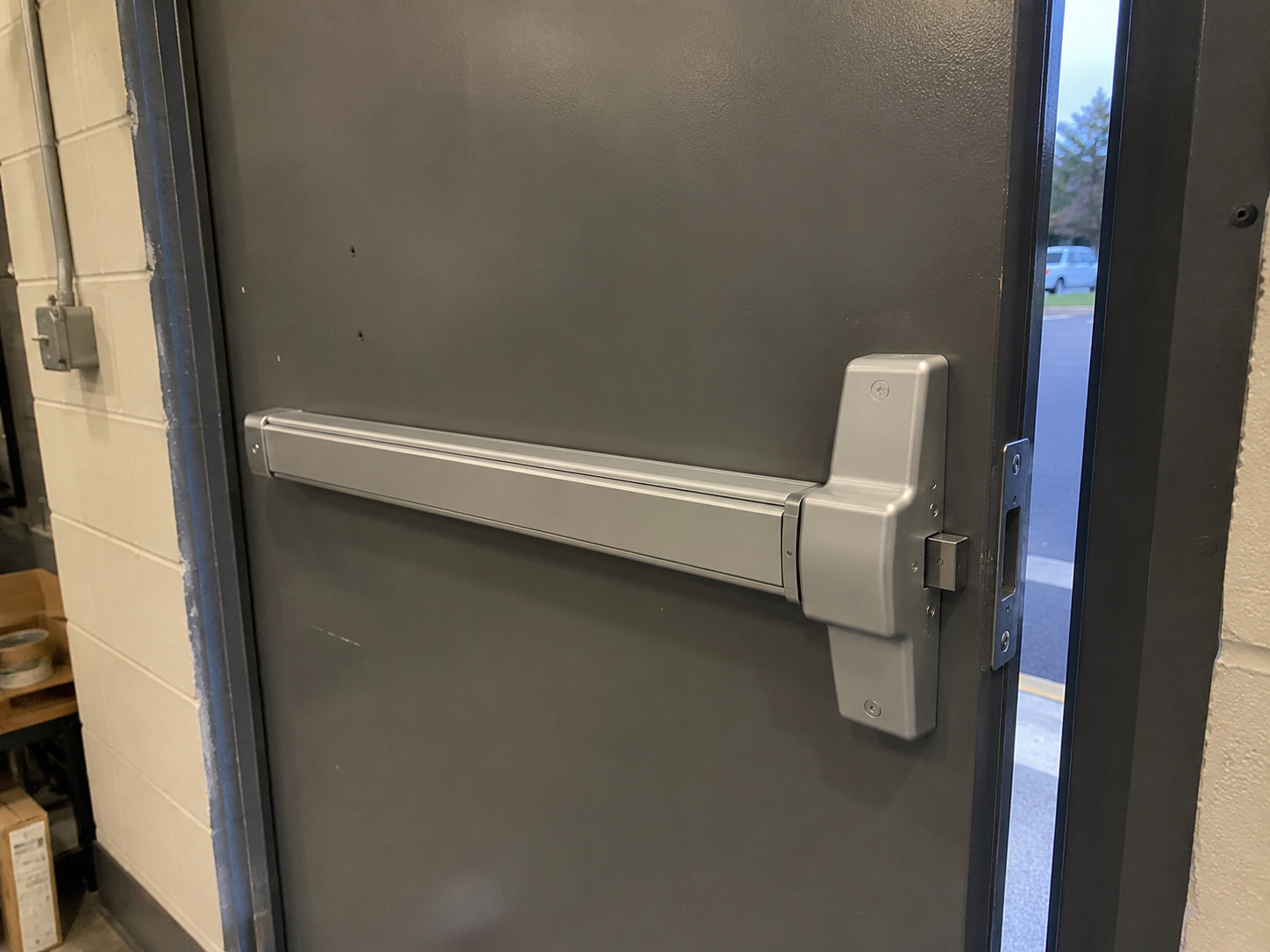 Rim exit device installed on commercial door in Delaware